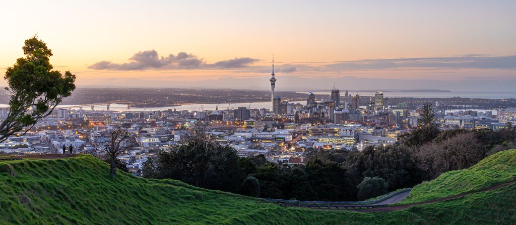 Auckland City Skyline With Auckland Sky Tower At Sunset
